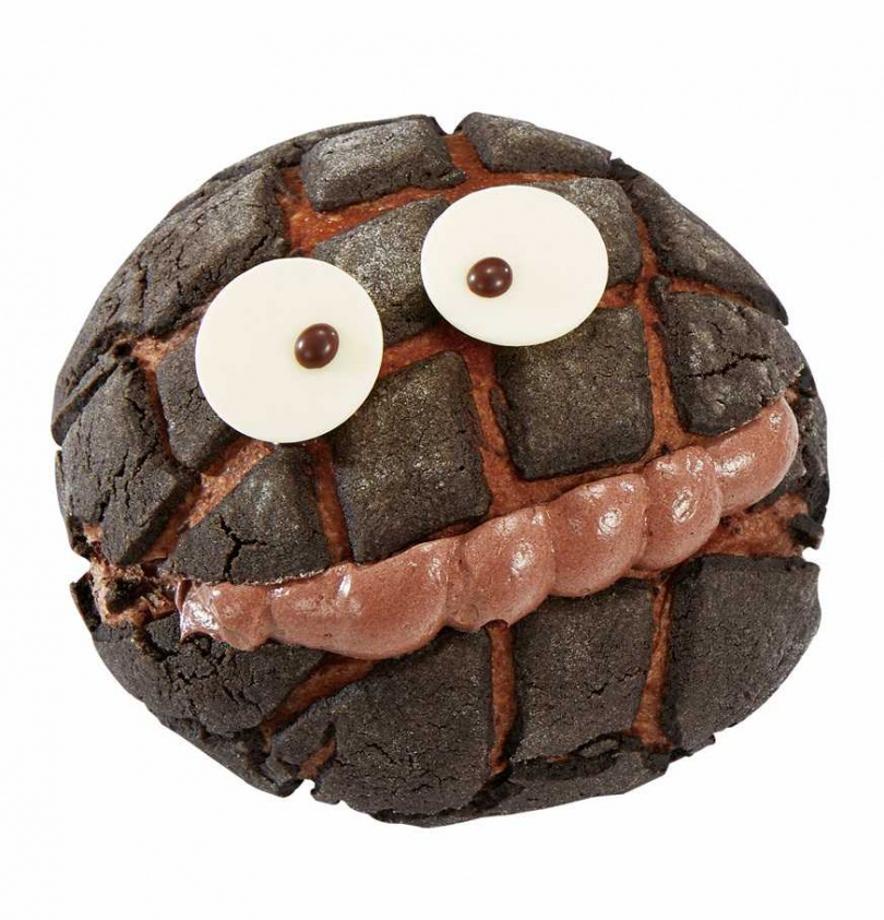 「菠蘿小鬼」35元，香軟巧克力麵包搭配可可風味菠蘿皮和滑順的巧克力奶油，裝飾上可愛的眼睛。