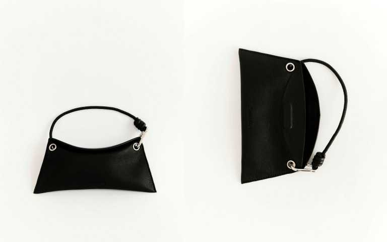 隨附的皮質掛手眼鏡包盒同樣講究，超級有質感的外型，加上磁吸開合與掛手式設計，讓收納也成為造型的一部分。（圖／品牌提供）