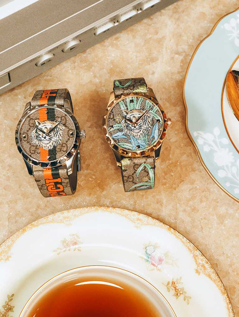GUCCI「Tiger G-Timeless」系列，虎年主題金色、銀色錶圈腕錶，38mm╱32,000元。（圖╱GUCCI提供）